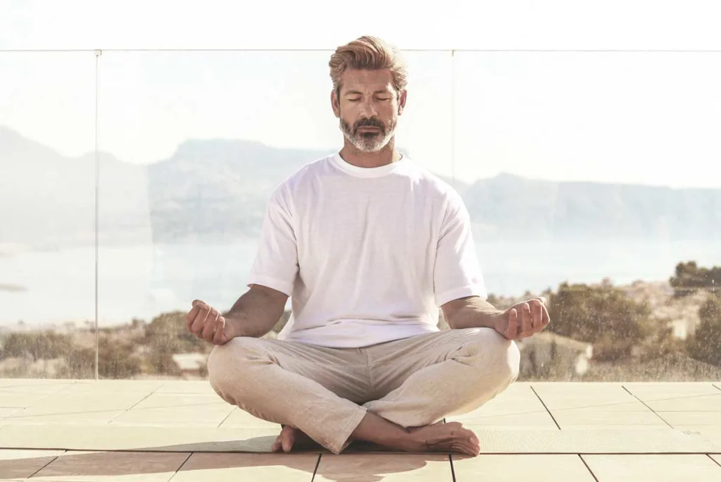 SHA Wellness Clinic longevity spa man practicing meditation